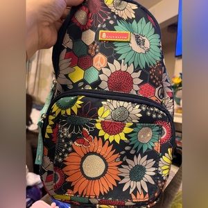 Lily Bloom sunflower peace sling backpack